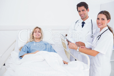 Smiling patient and doctors