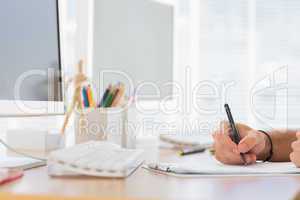 Hand writing in a modern office