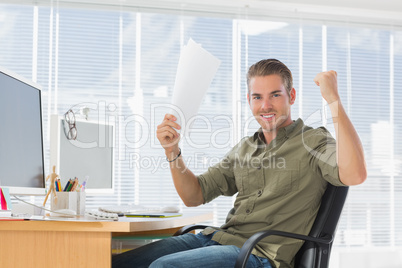 Creative business employee raising arms