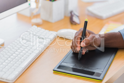 Close up of a graphic designer using graphics tablet