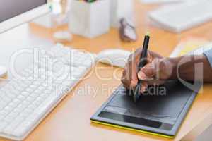 Close up of a graphic designer using graphics tablet