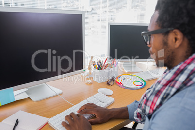 Business worker with reading glasses on computer