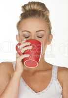 blonde woman drinking caffee