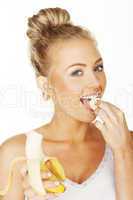happy blonde eating banana