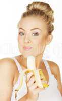 happy woman eating banana