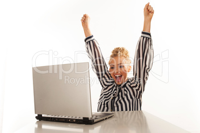 exited blonde woman working on laptop