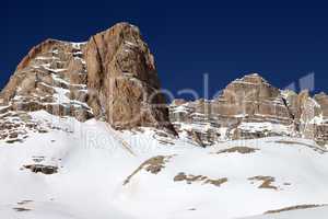 rocks in snow and clear blue sky