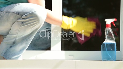 Woman cleaning the window