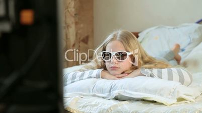 Little Girl Watching 3D TV at Home