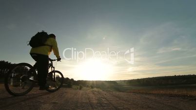 Cross-country cycling at sunrise