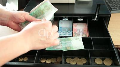 cash register drawer with ukrainian money