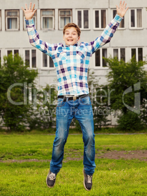 Portrait of the teenager boy in outdoors