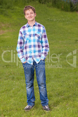 Portrait of the teenager boy in outdoors