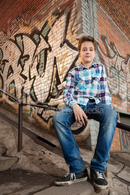 Portrait of the teenager boy in outdoors