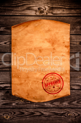 Blank old paper against the background of an aged wood