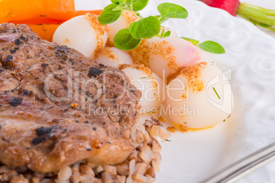 grill chop, buckwheat groats and roasted radishes