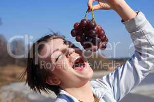 Girl Eating Grapes