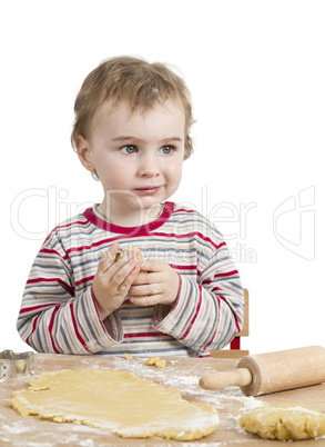 happy young child with rolling pin in white background