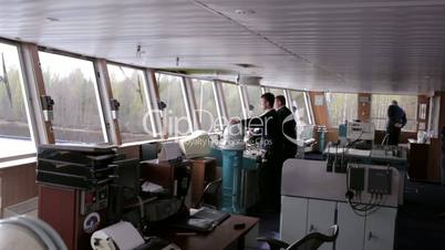 Navigation officer driving the cruise liner on the river 3