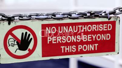 Sign - No unauthorized persons permitted beyond this point.