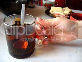 hand with a cup of tea