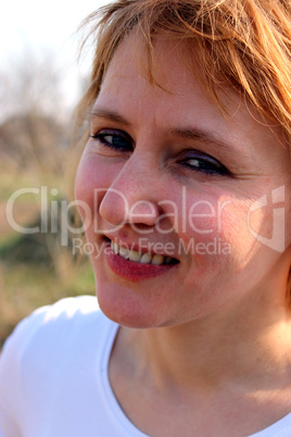 blue-eyed sympathetic girl looking at the sky