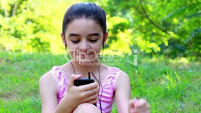 Girl listening to music on a smartphone