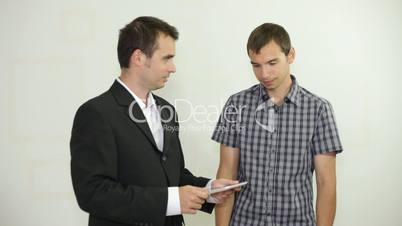 Happy businessmen with tablet