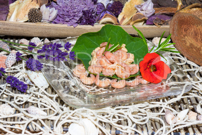 Serving of gourmet shrimps with herbs