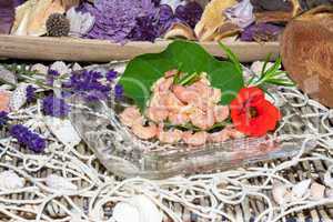 Serving of gourmet shrimps with herbs