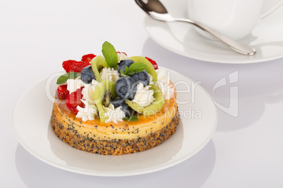 Cheesecake, strawberries, blueberries and kiwi