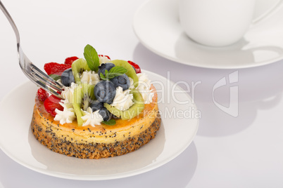 Cheese-cake, strawberries, blueberries and kiwi