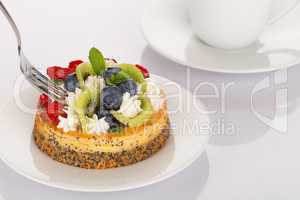 Cheese-cake, strawberries, blueberries and kiwi