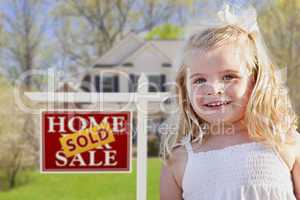 Cute Girl in Yard with Sold For Sale Real Estate Sign and House