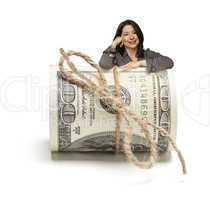 Hispanic Woman Leaning on a Roll Of Hundred Dollar Bills