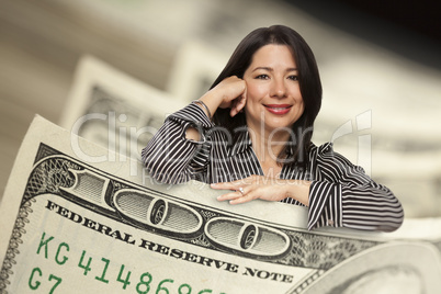 Hispanic Woman Leaning on a One Hundred Dollar Bill