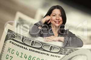 Hispanic Woman Leaning on a One Hundred Dollar Bill