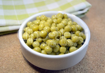 Canned green peas on a table