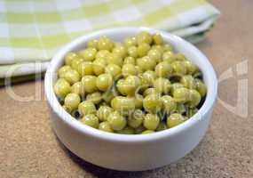 Canned green peas on a table