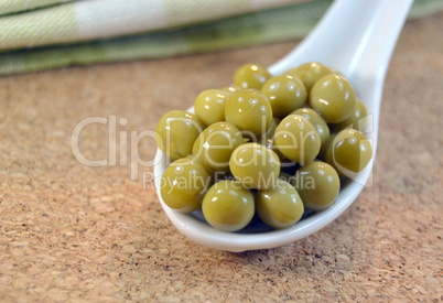 Canned green peas on a table