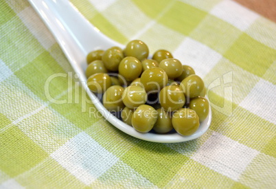 Canned green peas on a table