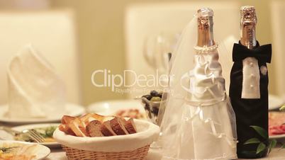 wedding table with glasses and bottles of champagne