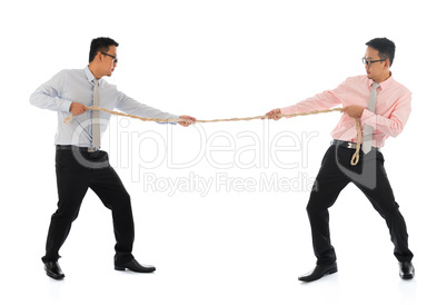 Two Asian businessmen pulling a rope