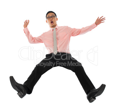 Asian businessman falling backwards