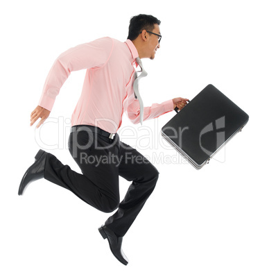 Asian businessman running or jumping