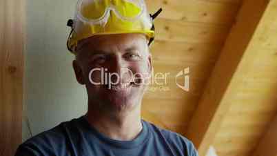 Construction worker, portrait of happy mason smiling at camera