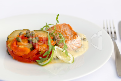Fish fillet, sauce and vegetables