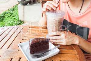 Coffee break with iced coffee and chocolate cake