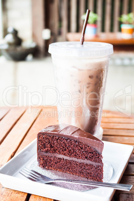 Delicious meal with iced coffee and chocolate cake