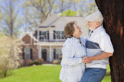 Happy Senior Couple in Front Yard of House